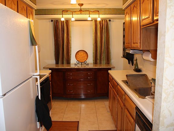 Kitchen has handcrafted cabinetry, custom ceramic design, & huge pantry