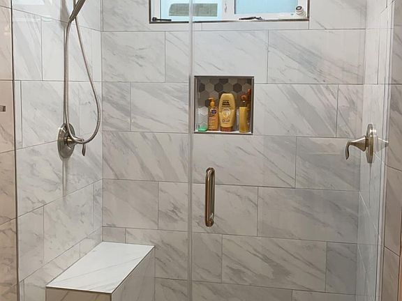 Master restroom with 2 shower heads and built in bench. Home has water softener/ carbon filter.