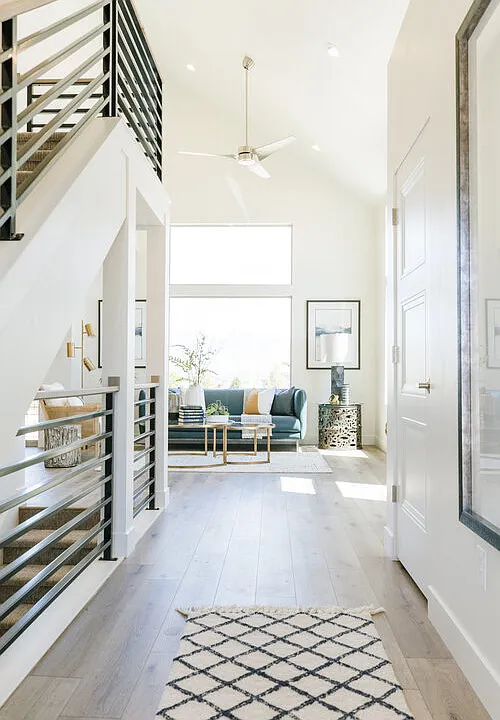 Vaulted entry and main living area with bright oversized windows