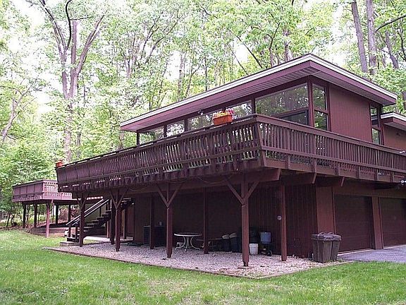 Entertain on large adjoined decks with hot tub in private wooded setting