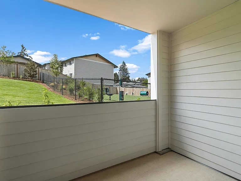 Covered apartment patio with outdoor living space, scenic views, landscaped grounds, and nearby community amenities. Covered apartment patio with outdoor living space, scenic views, landscaped grounds, and nearby community amenities.