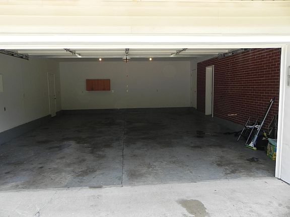 Deep 2 1/2 car garage with new garage door and opener with outdoor key pad .