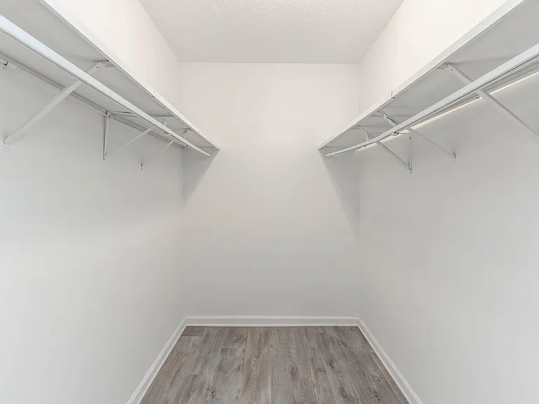 Spacious walk-in closet with plenty of storage space.