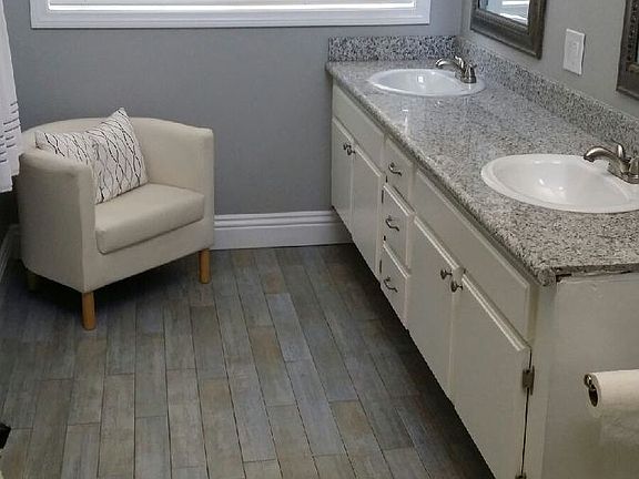 Custom tile in master bathroom, modern shower with framless