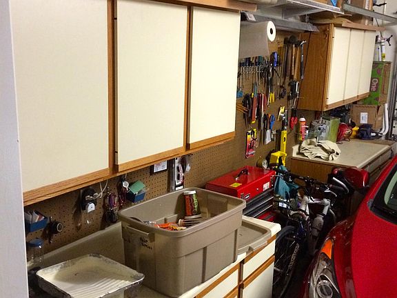 2 car garage includes cabinets for storage