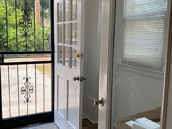 Apartment #1 has a great laundry, mudroom & storage area, with back door leading to off-street parking space