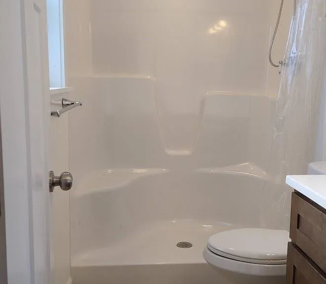 bathroom flooring is stone-look vinyl plank