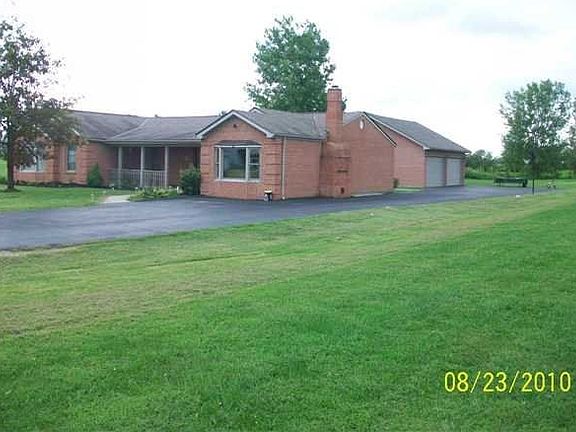 Right Side showing 4 car garage