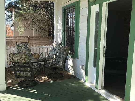 Cozy, comfy seating area on porch; cardinal's nest in chandelier from last year