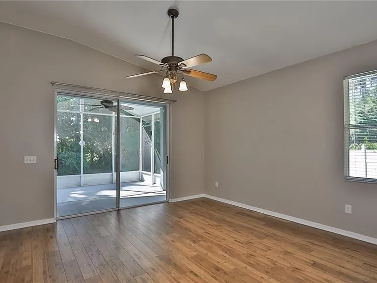 Tv room with entrance to screen in lanai