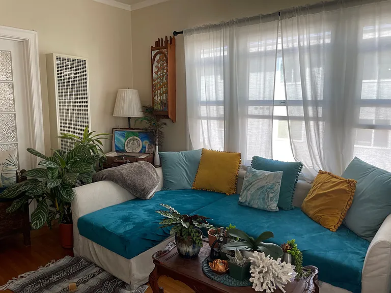Living room as furnished by previous tenants