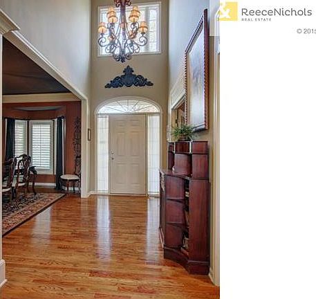 Front entry boasts soaring ceilings