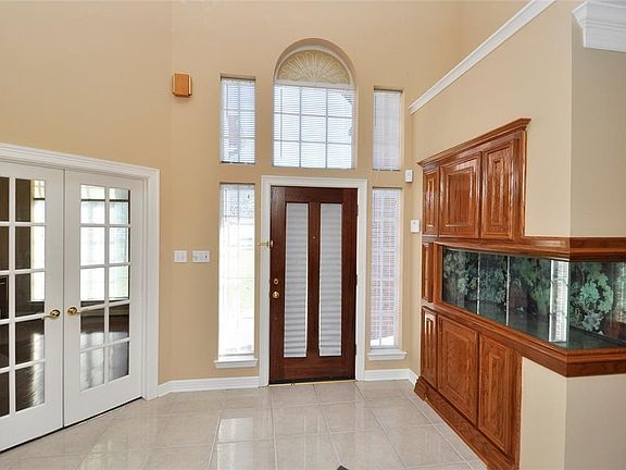 Nice entry with a gorgeous front door and aquarium.