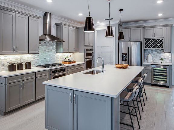 Kitchen with Large Center Island and Optional Entertainment Package