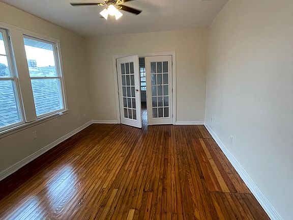 View of front bedroom with french doors to living room closed.