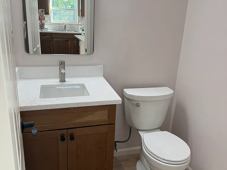 Half bath off kitchen and living area
