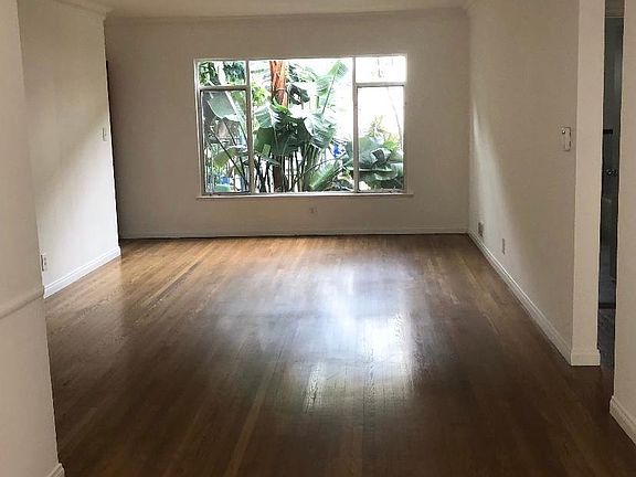 Large windows allowing natural light in. Hardwood flooring that makes this unit the perfect home
