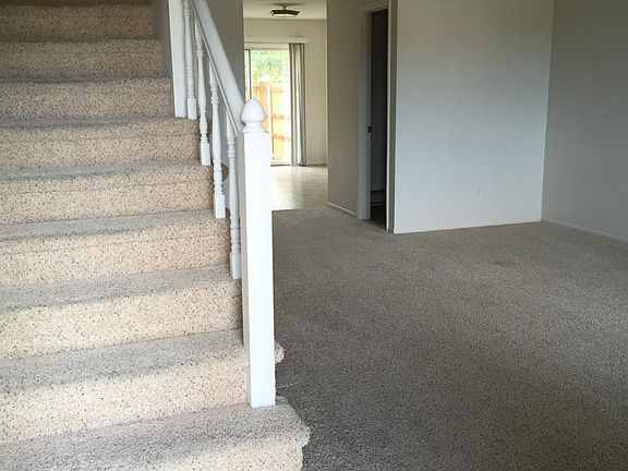 Living Room with staircase to bedrooms