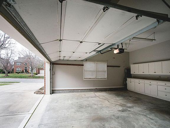 2/12 car garage (room for a golf cart!) Lots of shelves, cabinets, and storage space