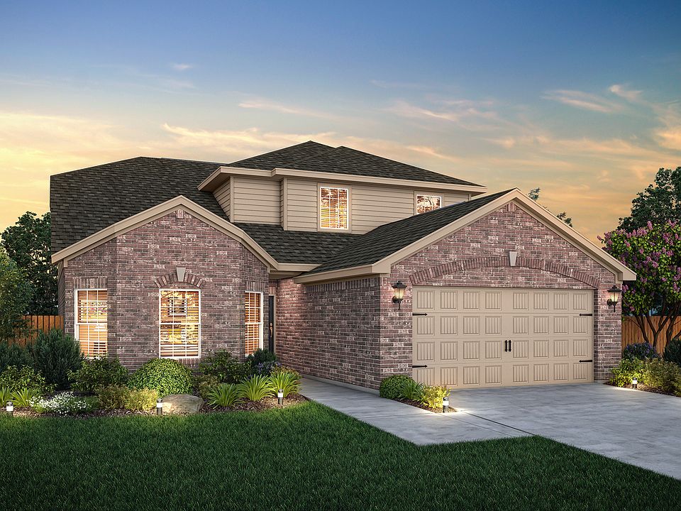 The Cypress plan at dusk in the incredible community of Pinewood Trails