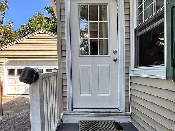 Side entrance leads to a mudroom, off of the kitchen