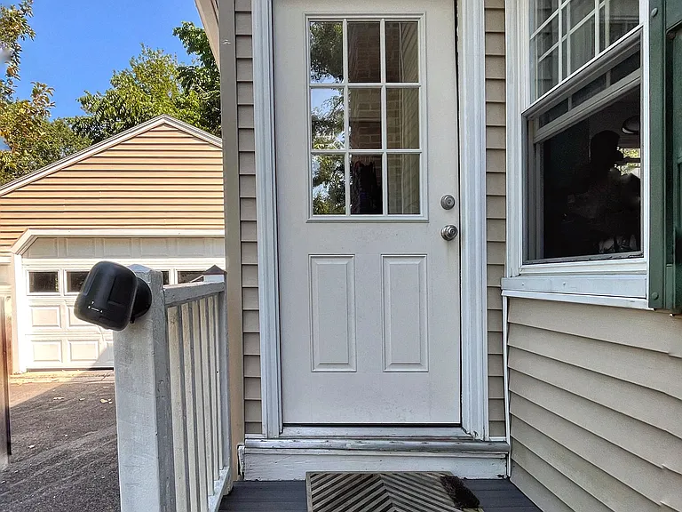 Side entrance leads to a mudroom, off of the kitchen