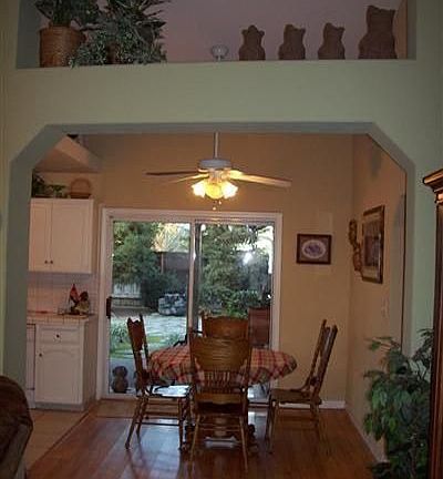 Living room shot to the kitchen an dinette.