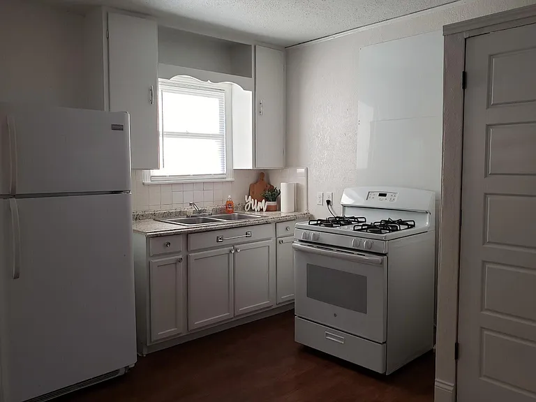 Kitchen with full size refrigerator and stove included.