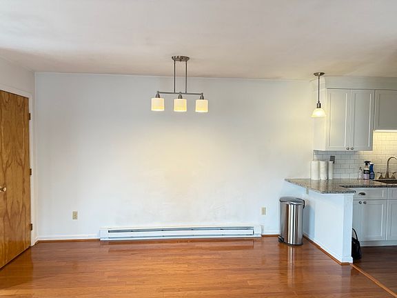 Open floor plan with large dining area and small breakfast bar.