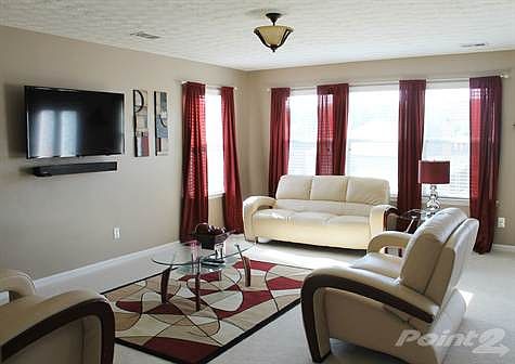 Familyroom's openfloor plan leads to a wonderful view of outdoors..