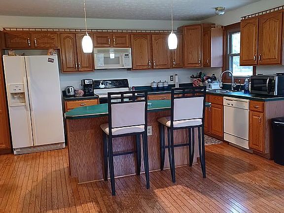 Kitchen island.  Hardwood floors