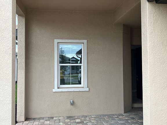 Specious entrance with paved driveway and entrance