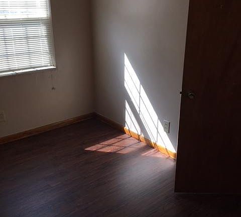 bedroom with brand-new luxury vinyl plank flooring 