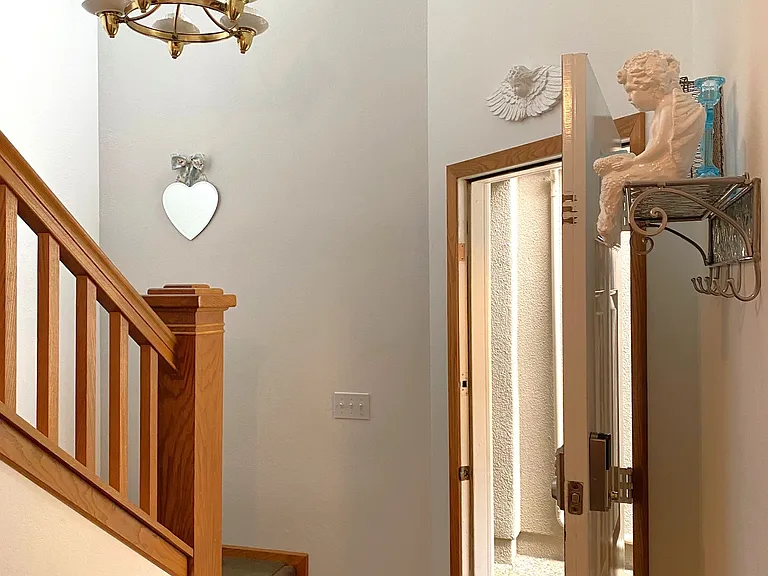 Pretty Teacup Chandelier Welcomes You Upstairs