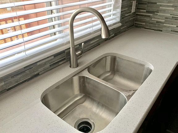 New backsplash, sink, faucet, tops
