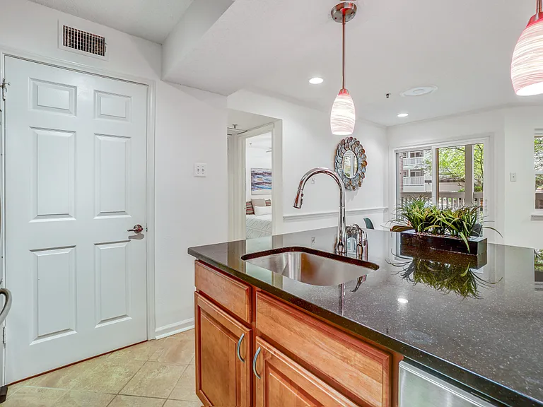 Separate laundry room off kitchen.