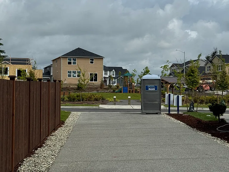 View of 70 foot private driveway leading from home to street.
