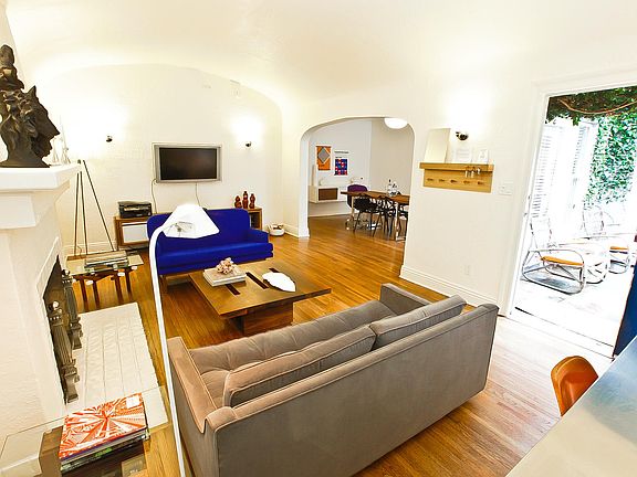 As you enter the front door you arrive into the living room with fire place.