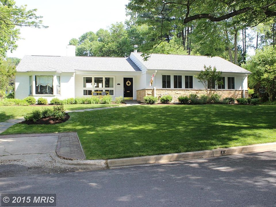 Sun filled expanded rambler on large corner lot