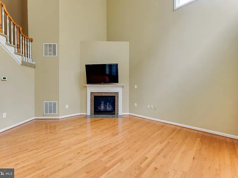 Great Room/ Family Room with 19' cathdral ceiling, lots of windows to let in natural light