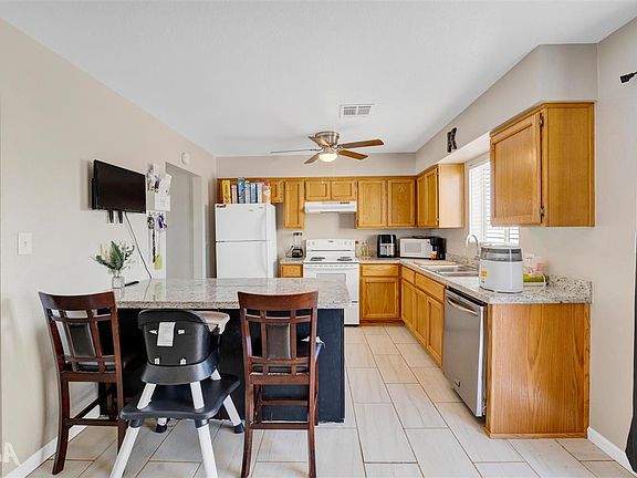 5th image of 8541 E 39th Pl