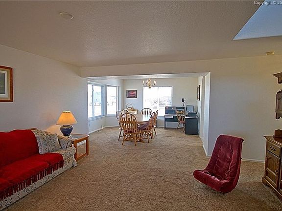 Entry through the living room to the spacious dining room.