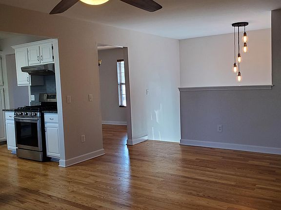 Entryway has hardwood floors, new fixtures and new paint all throughout.