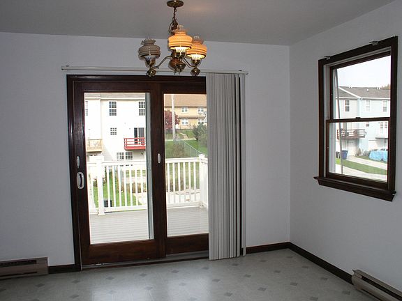 Looking from kitchen sink to the deck. There is a new cieling fan/ light combo here and in both bedrooms.