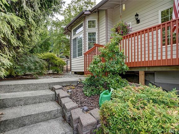 Beautiful mature landscape greets you as you make your way to the front entrance.