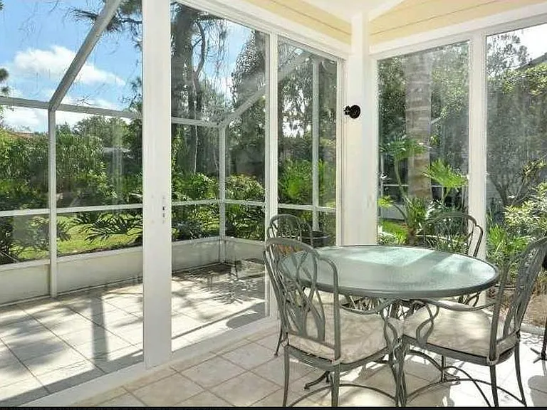 Air conditioned Sun Room can be used as dining or office area. Opens to screened lanai.