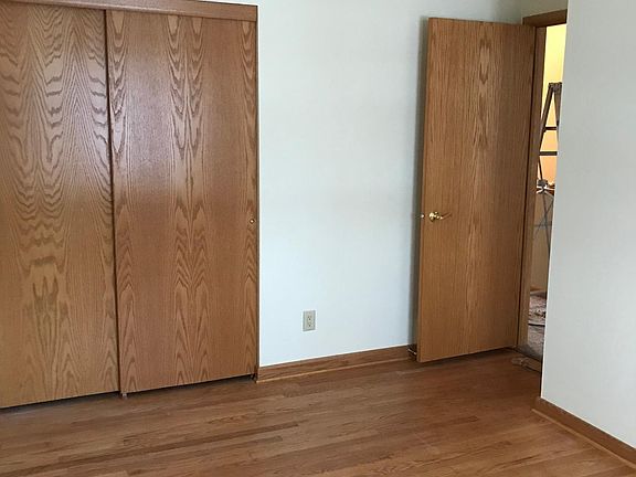 Bedroom with hardwood floors.