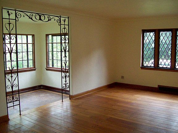 Sophisticated living room and den with pegged oak floors