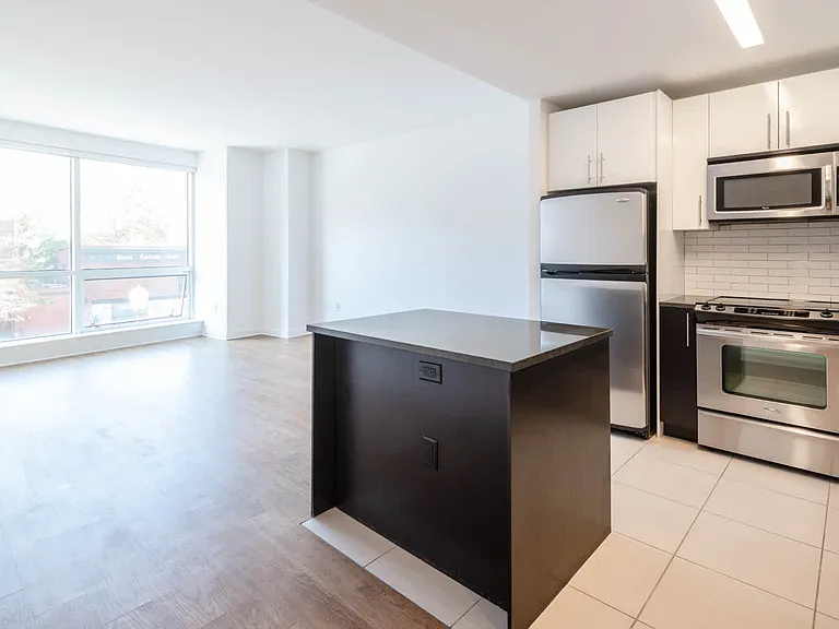 Living Room and Kitchen with Stainless Steel Appliances