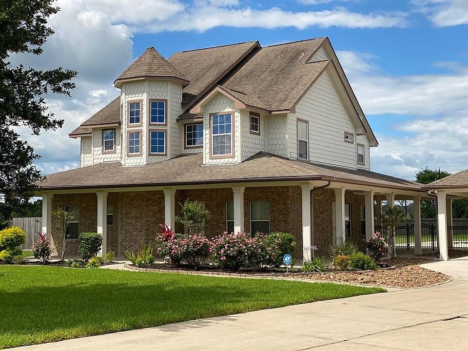 This beautiful home has a wrap around porch, fresh landscaping, a 15,000 watt generator, fully fenced backyard, very large RV building that has a room, full bath, huge storage closet with shelves and extra storage above.